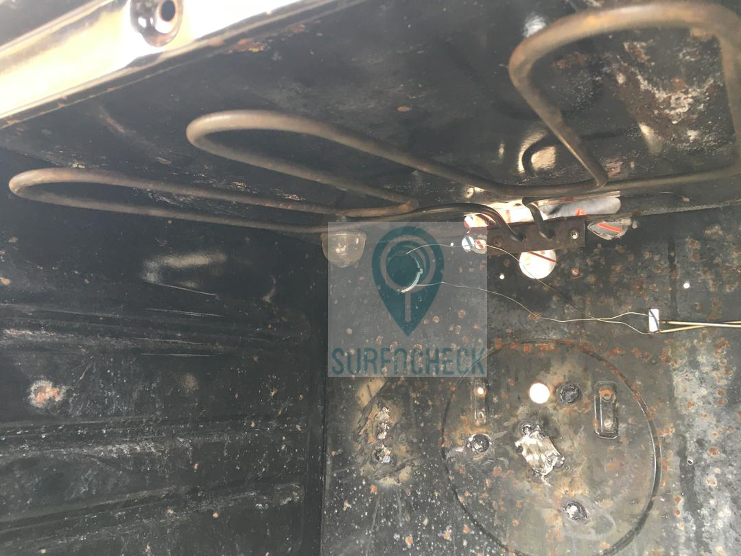 INNER COMPARTMENT OF THE COOKER DURING REPAIRS
